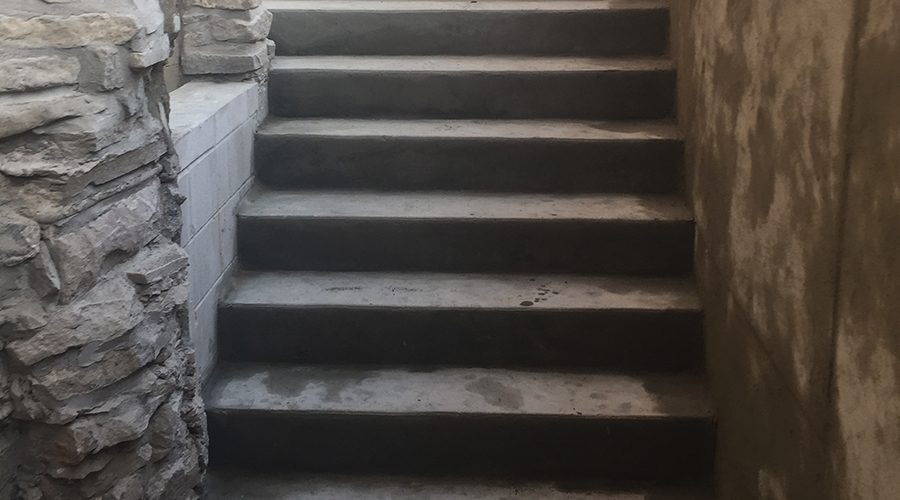 Concrete stairs built for a basement walkout by Mace Masonry