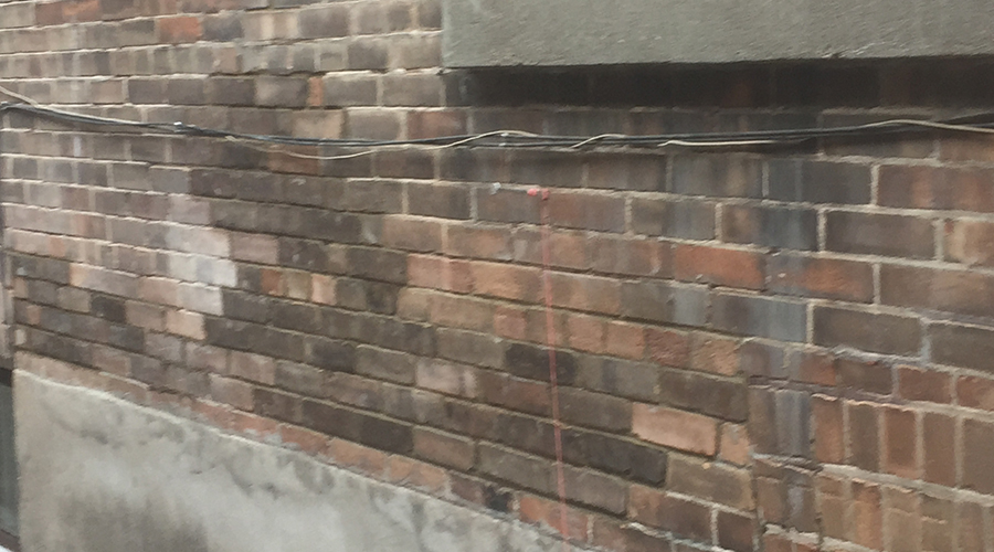 Old brick buidling after a brick replacement project by Mace Masonry